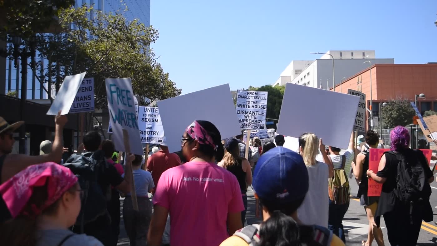 marchers with signs in downtown los angeles